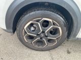 a close up of a tire on the side of a car