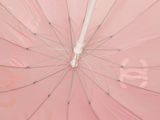 a pink umbrella with a white handle and a white handle