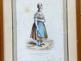 a framed picture of a woman in a blue dress