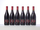 six bottles of red wine lined up in a row