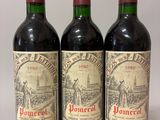 three bottles of wine sitting on top of a table next to each other