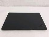 the laptop is sitting on a white surface with a white background