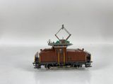 a toy train with a crane on top of it