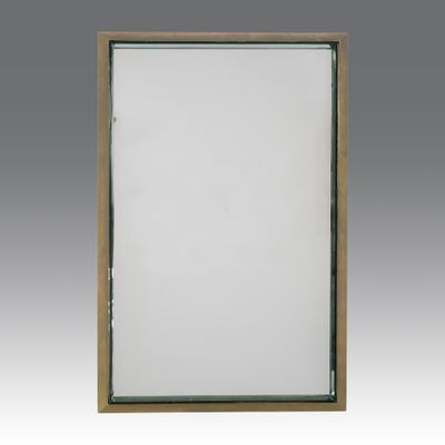 a large mirror with a wooden frame and a white background