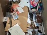 a cardboard box full of various items in a room