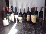 many bottles of wine lined up on the counter