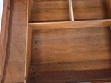 a wooden box that has a drawer inside of it