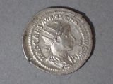 a close up of a silver coin with a woman on it