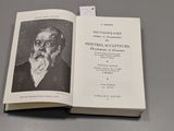 an open book with a picture of a man in a suit and tie