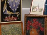 three framed pictures of flowers and a vase on a table