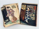 two old books with asian designs on them on a table