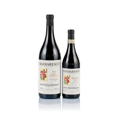 two bottles of wine sitting next to each other on a white surface
