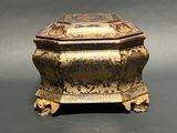 a small box with a lid on a table