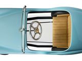an overhead view of a blue car with a steering and dashboard