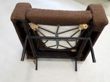 a chair that has a pillow on top of it