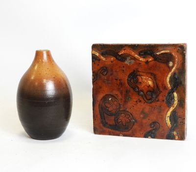 two vases sitting next to each other on a white surface