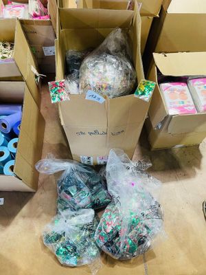 several boxes filled with assorted items sitting on a wooden floor