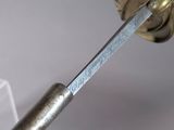 a close up of a sword with a metal handle
