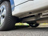 a close up view of a car ' s tire on the road