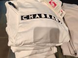 a lot of t - shirts that are on display in a store