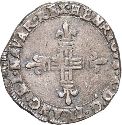 a close up of a coin with a cross on it