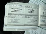 a stack of papers sitting on top of a table