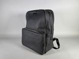 a black backpack sitting on top of a white table