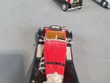 three toy cars that are sitting on a table