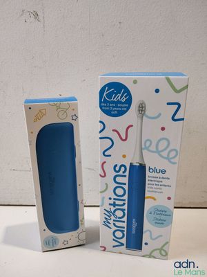 a blue electric toothbrush sitting next to a box