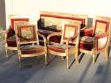 four chairs and a couch in the middle of a parking lot