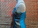 a close up of a mannequin with a blue top on it