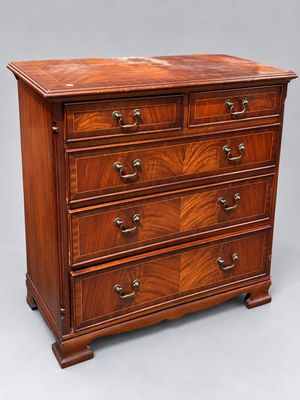 an antique mahogany chest of drawers