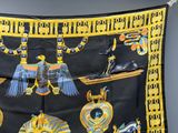 an image of a black and yellow scarf with egyptian symbols on it