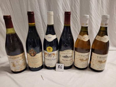 several bottles of wine are lined up on a table