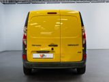 a yellow van that is parked in a room