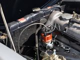 a close up view of a car engine with its hood open