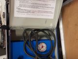 a box with a pressure gauge in it on a table