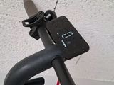 a clock mounted to the side of a pole on a wall