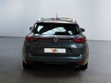 the rear end of a grey car with a license plate on it