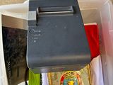 a plastic container with a printer on top of it