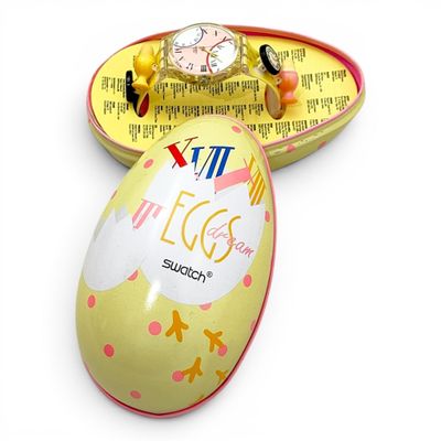 an egg shaped box with a watch inside of it