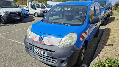 a blue van that is parked on the side of the road