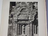 an open book with a picture of a doorway in the middle of it
