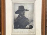 an old black and white photograph of a man in a cowboy hat