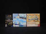 three games on the table with a black background
