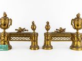 two golden vases sitting on top of a table