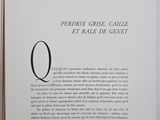 an open book with a black and white image of the letter q