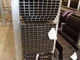many different types of steel bars stacked on a rack