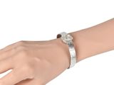 bracelet with a silver metal band and a white stone in the center