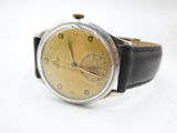 an image of a wrist watch with a yellow dial